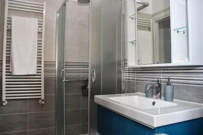 a bathroom with a sink and a shower at B&B J&B in Rome