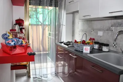 a kitchen with a sink and a counter top at B&B J&B in Rome