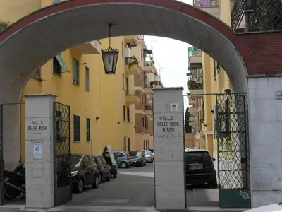 an archway over a street with cars parked at B&B J&B in Rome