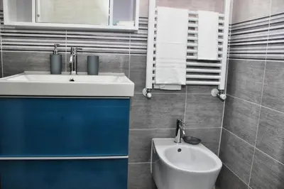 a bathroom with a sink and a toilet at B&B J&B in Rome