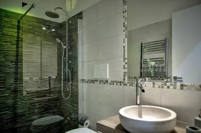 a bathroom with a sink and a shower at TinkerBell GuestHouse in Rome