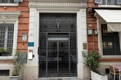 an entrance to a building with an iron gate at Vatican Plaza in Rome