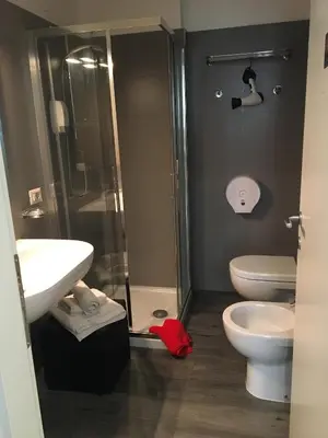 a bathroom with a shower and a sink and a toilet at Your House By Ale in Rome