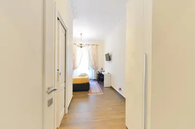 a bedroom with a bed with two lamps on it at Vietitaly Filiberto in Rome