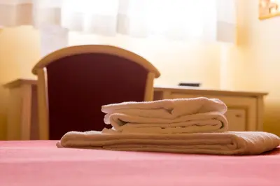 a pile of towels sitting on top of a table at Sweet Dream Trevi in Rome