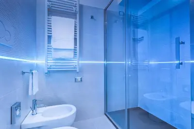 a bathroom with a shower and a toilet and a sink at Shali Luxury Suite Spagna in Rome