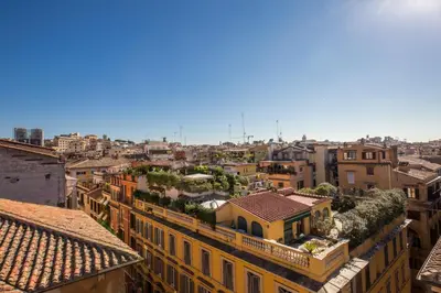 a view of a city from the roofs of buildings at Hotel La Lumiere Di Piazza Di Spagna in Rome