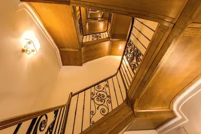 an overhead view of a staircase with wooden railings at Hotel La Lumiere Di Piazza Di Spagna in Rome