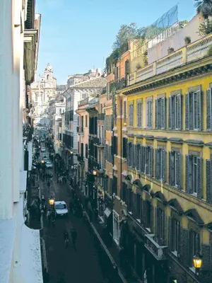 a view of a city street with cars and buildings at Hotel La Lumiere Di Piazza Di Spagna in Rome
