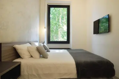 a bedroom with a large bed with a window at Room with a view 105 in Rome