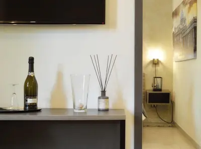 a bottle of wine on a table in a room at Room with a view 105 in Rome
