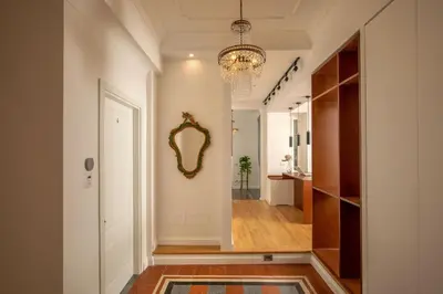 a hallway with a mirror on the wall at Domus Serafino in Rome