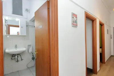a bathroom with a toilet and a sink at Lucky Home rooms in Rome