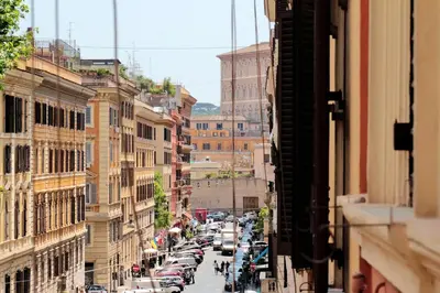 a view of a city street with parked cars at St. Peter Vatican Rooms in Rome