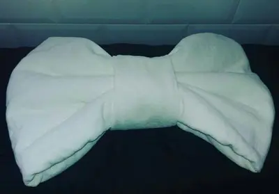 a white blanket on top of a bed at Velvet Suite in Rome