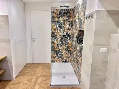 a bathroom with two sinks and a large mirror at Vicolo Doria Apartment in Rome