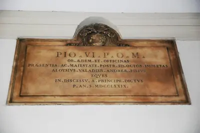 a picture of a plaque on a wall at Exclusive apartment a few steps from the Spanish Steps in Rome