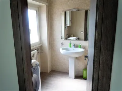 a bathroom with a sink and a mirror at Attico luminoso terrazza Metro A Aria Cond WiFi in Rome