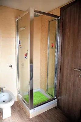 a shower stall in a bathroom with a toilet at Attico luminoso terrazza Metro A Aria Cond WiFi in Rome