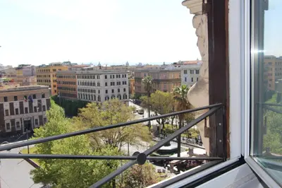 a view of a city from a window at La Rosa del Vaticano Luxury Apartment in Rome