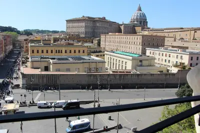 a view of a city with a parking lot at La Rosa del Vaticano Luxury Apartment in Rome