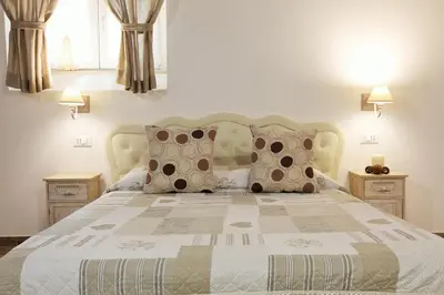 a bedroom with a large bed with pillows at Navona Sweet Home in Rome