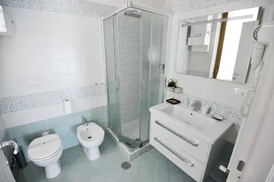 a bathroom with a toilet and a sink and a shower at Le Fontane di Roma in Rome