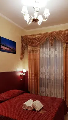 a bedroom with a bed with two towels on it at Vertex Palace in Rome