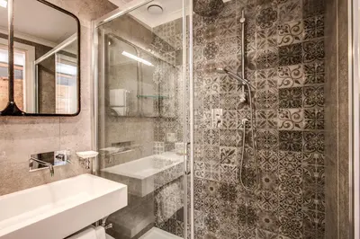 a bathroom with a sink and a shower at Parlamento Boutique Hotel in Rome