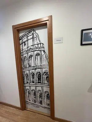 a drawing of a building on a glass door at Rooma Beb in Rome
