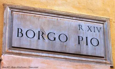 a sign on the side of a building at Rome Services Borgo Suites in Rome