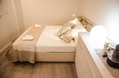 a small bedroom with a bed with towels on it at Madonna dei Monti in Rome