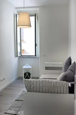 a living room with a couch and a window at Madonna dei Monti in Rome
