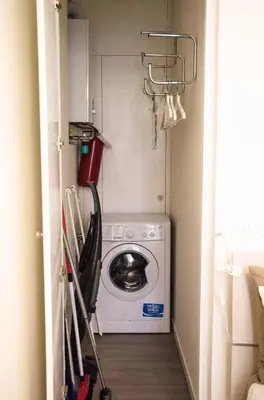 a small laundry room with a washer and dryer at Madonna dei Monti in Rome