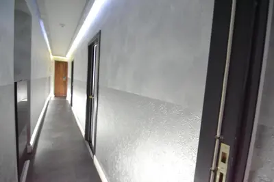 a hallway with a door and a hallwayngthngthngthngthngthngthngthngth at Glamour Spanish Steps in Rome