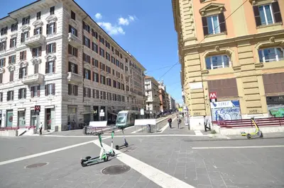 a scooter parked in the middle of a city street at Glamour Spanish Steps in Rome