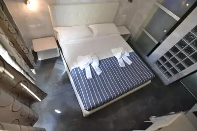 an overhead view of a bed with towels on it at Glamour Spanish Steps in Rome