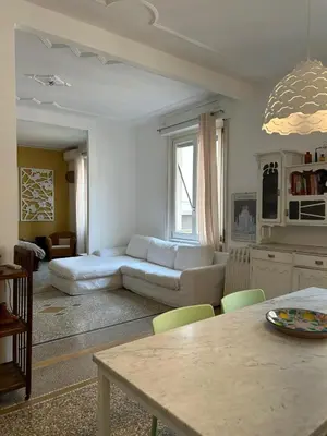 a living room with a couch and a table at Our Home in Rome - Via Machiavelli in Rome