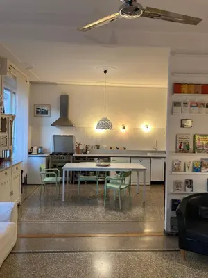 a kitchen with a table and chairs in a room at Our Home in Rome - Via Machiavelli in Rome