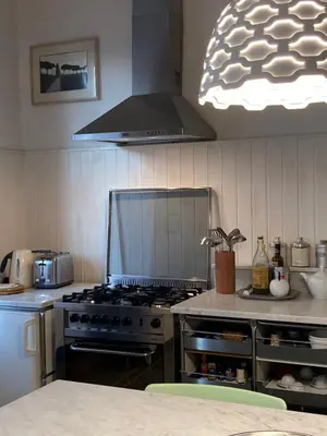 a kitchen with a stove top oven in a kitchen at Our Home in Rome - Via Machiavelli in Rome