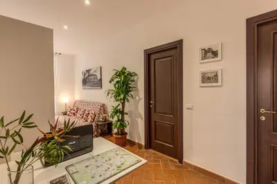 a living room with a couch and a table at Piccolo Trevi Suites in Rome