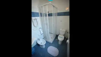 a bathroom with a shower and a toilet and a sink at Residenza Matilde in Rome