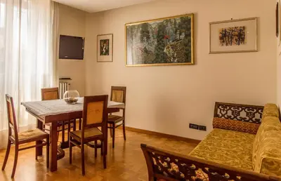 a living room with a table and a couch at Sant'Ivo Apartments in Rome