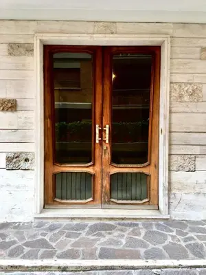 a wooden door on the side of a building at Roema Guest House in Rome