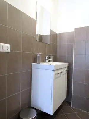 a bathroom with a sink and a toilet at Roema Guest House in Rome