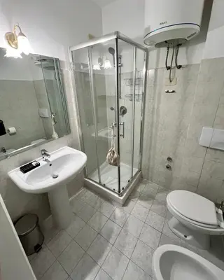 a bathroom with a shower and a sink and a toilet at Charming Navona in Rome