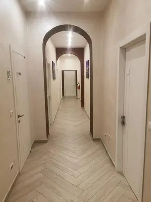 a hallway with an archway in a building at Penta Luxury House in Rome
