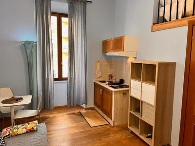 a small kitchen with a stove and a counter at MoonLight Suite in Rome