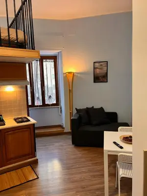 a living room with a couch and a table at MoonLight Suite in Rome