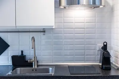 a kitchen counter with a sink and aaucet at Piazza Navona Lovely Apartment in Rome